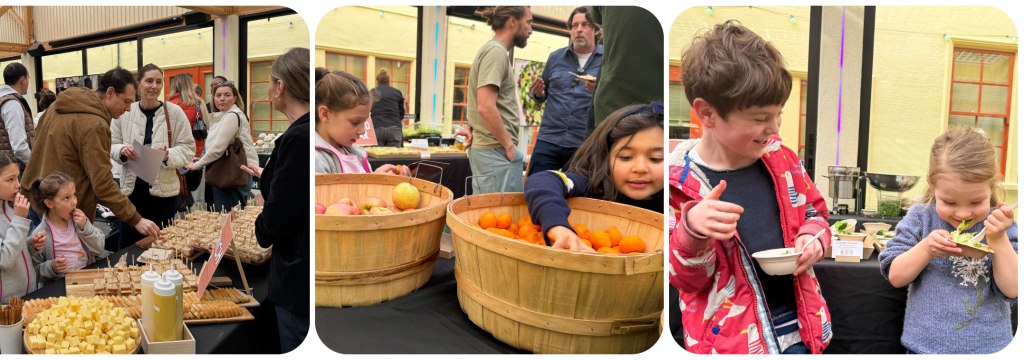 Families and children sampling fresh dishes and fruit at a cantine tasting event organized by Acre to showcase upcoming school meals.