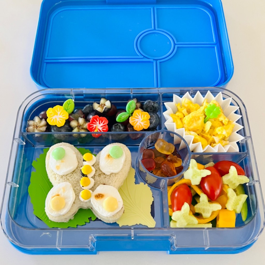 Butterfly-shaped egg sandwich in a kid's bento lunchbox