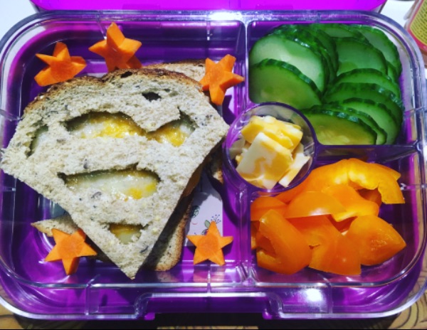 Supergirl Rules sandwich in a purple kids’ lunchbox with empowering lunchbox idea for girls.