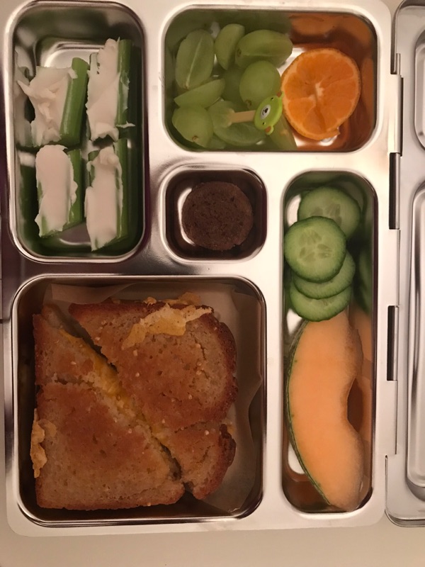 Celery sticks with cream cheese are a simple low sugar snacks that completes well a kid's packed lunch
