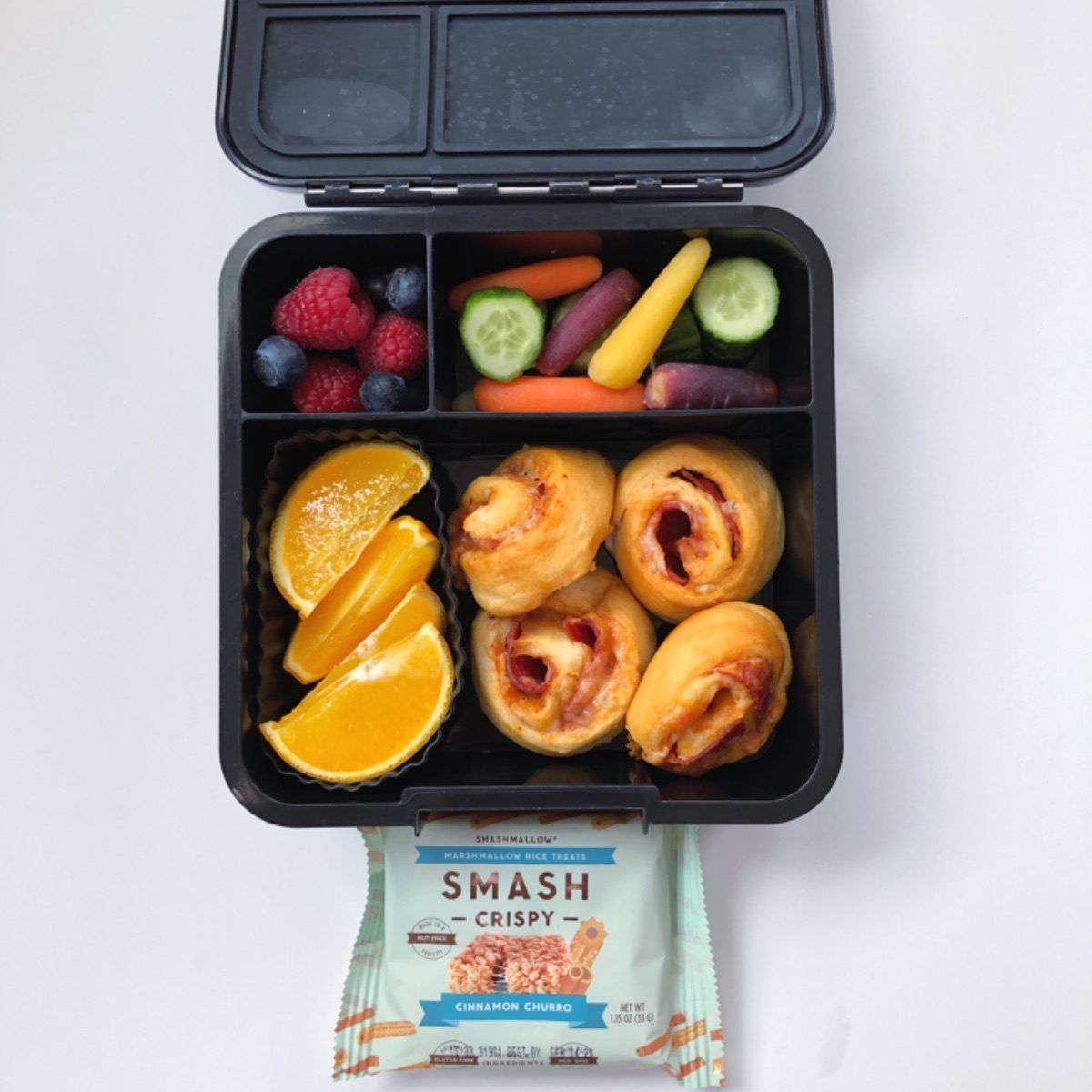 Kid's lunchbox with pizza rolls