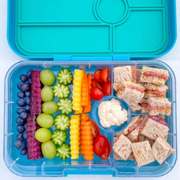 Rainbow colors with fruits and veggies in a Yumbox lunchbox