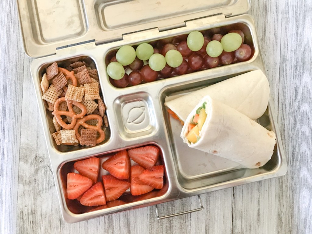 Hummus and veggie wrap for a kid's lunch at school