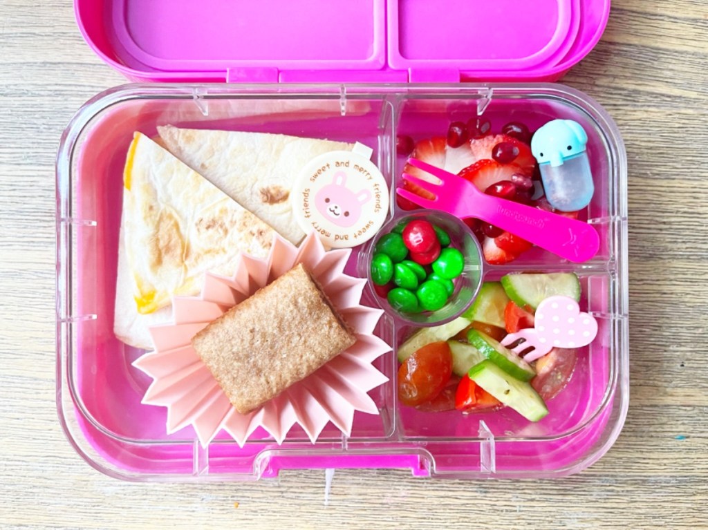 Delicious quesadilla in pink lunchbox