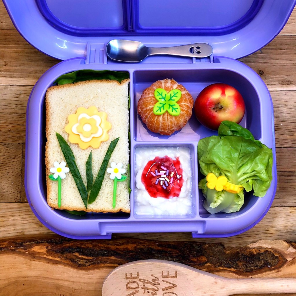 Sandwich and lettuce wrap in colorful kid's bento lunchbox