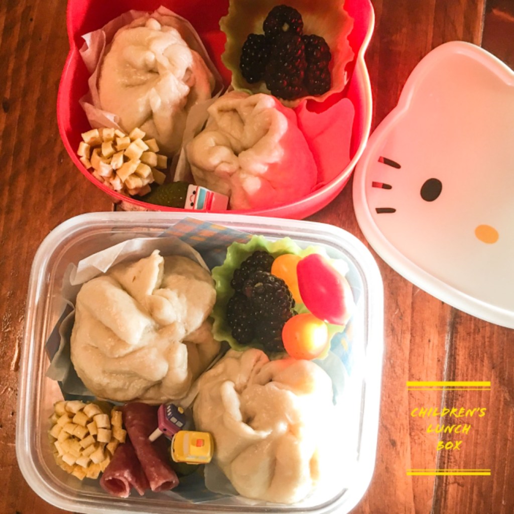 Pork bun dim sum in a Hello Kitty bento lunch box for kids