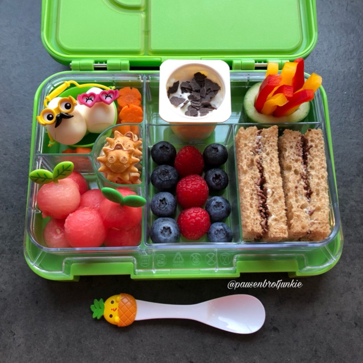 Lunchbox idea for kid with watermelon balls and sandwiches