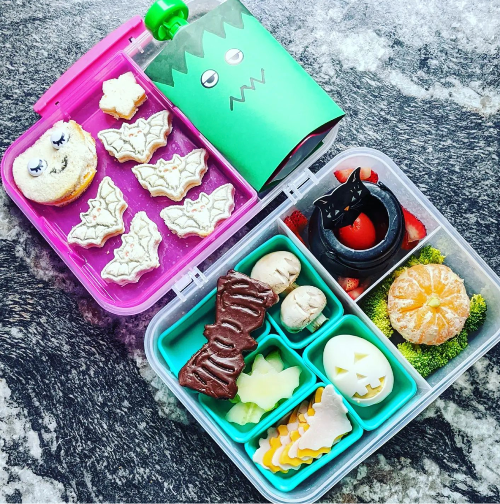 Mini sandwiches in a kid bento lunchbox celebrating Halloween