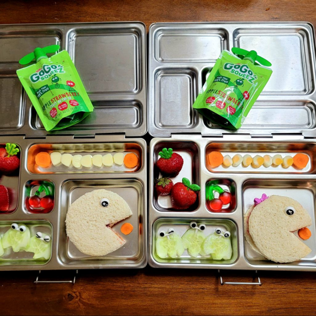 A cute "Pac Man and Mrs Pac Man" themed lunch shared by @pinterestmomwannabe on Teuko.com included sandwiches, cucumbers, carrot, strawberries, and an Apple-Strawberry Gogo squeeZ sauce.