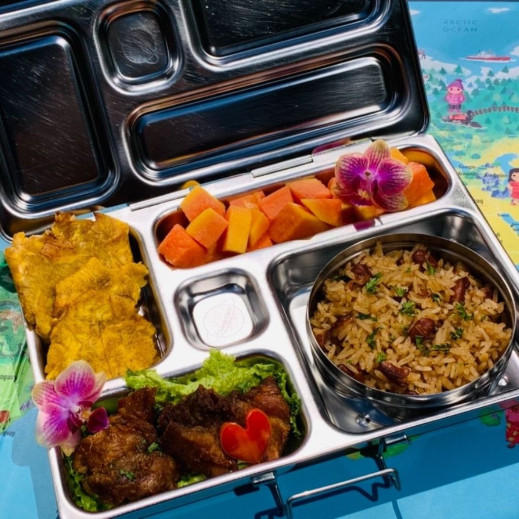 Kidscantwaitforlunch packed an Haitian-style lunchbox for her kid. Fried rice was mixed with red kidney beans. Pork and plantain chips on the side. Papaya for dessert. Yum!