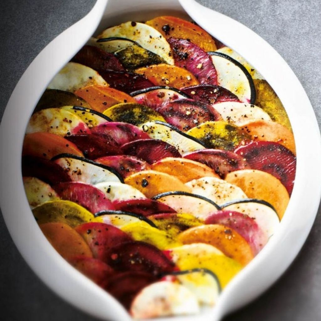 Chef Alain Ducasse created a “cookpot”, a colorful dish with sliced roasted beets and veggies that look like a tian or a gratin.