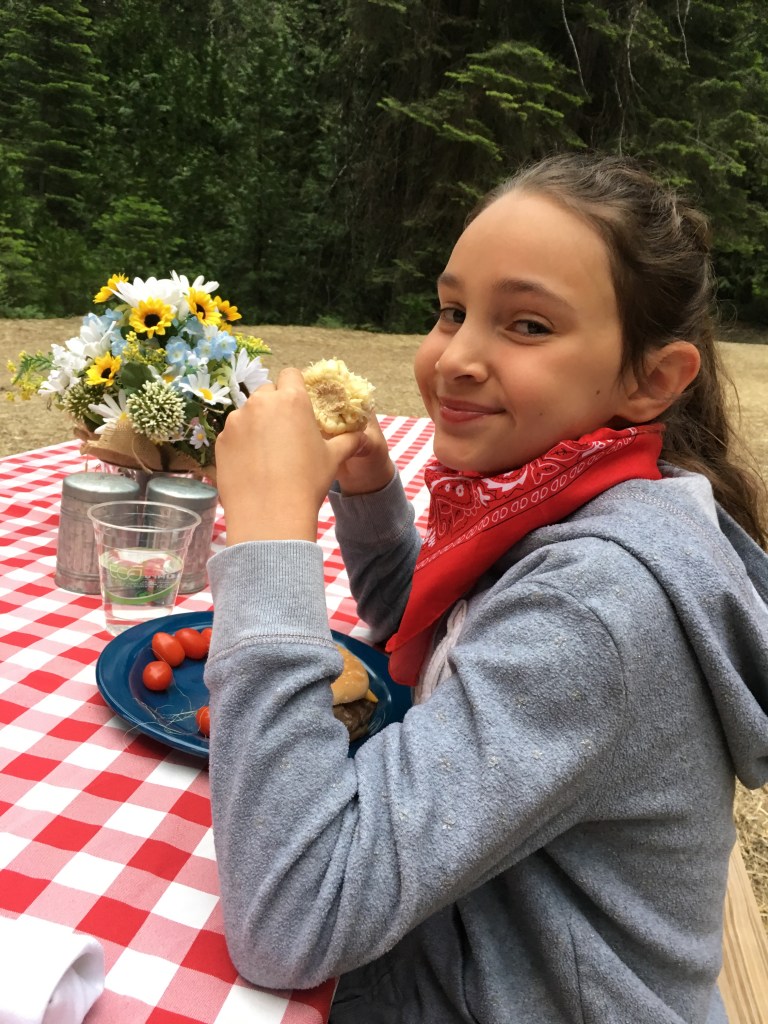 Teuko kid having a great time eating her "good ol' country cookin" dinner