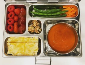 Delicious tomato soup packed in a kid's lunchbox.